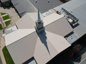 Commercial metal roof of a church after P.I. Roofing completed the repair