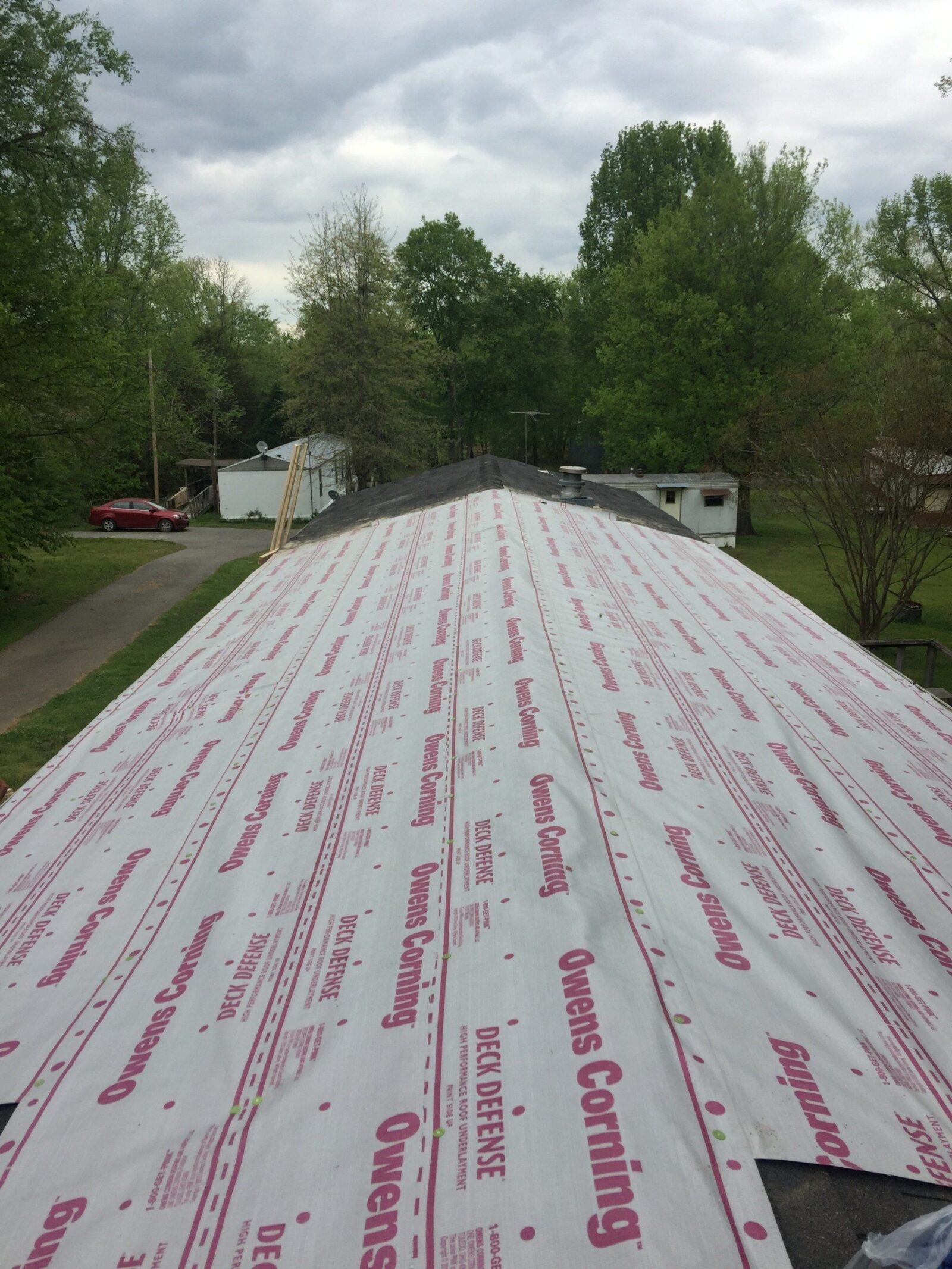 Newly installed High Performance Synthetic Roof Underlayment as shield from interior damage during roof installation.